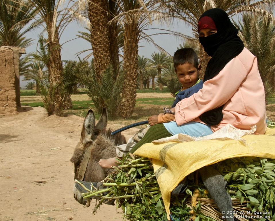 Oasis woman with boy shuns attention