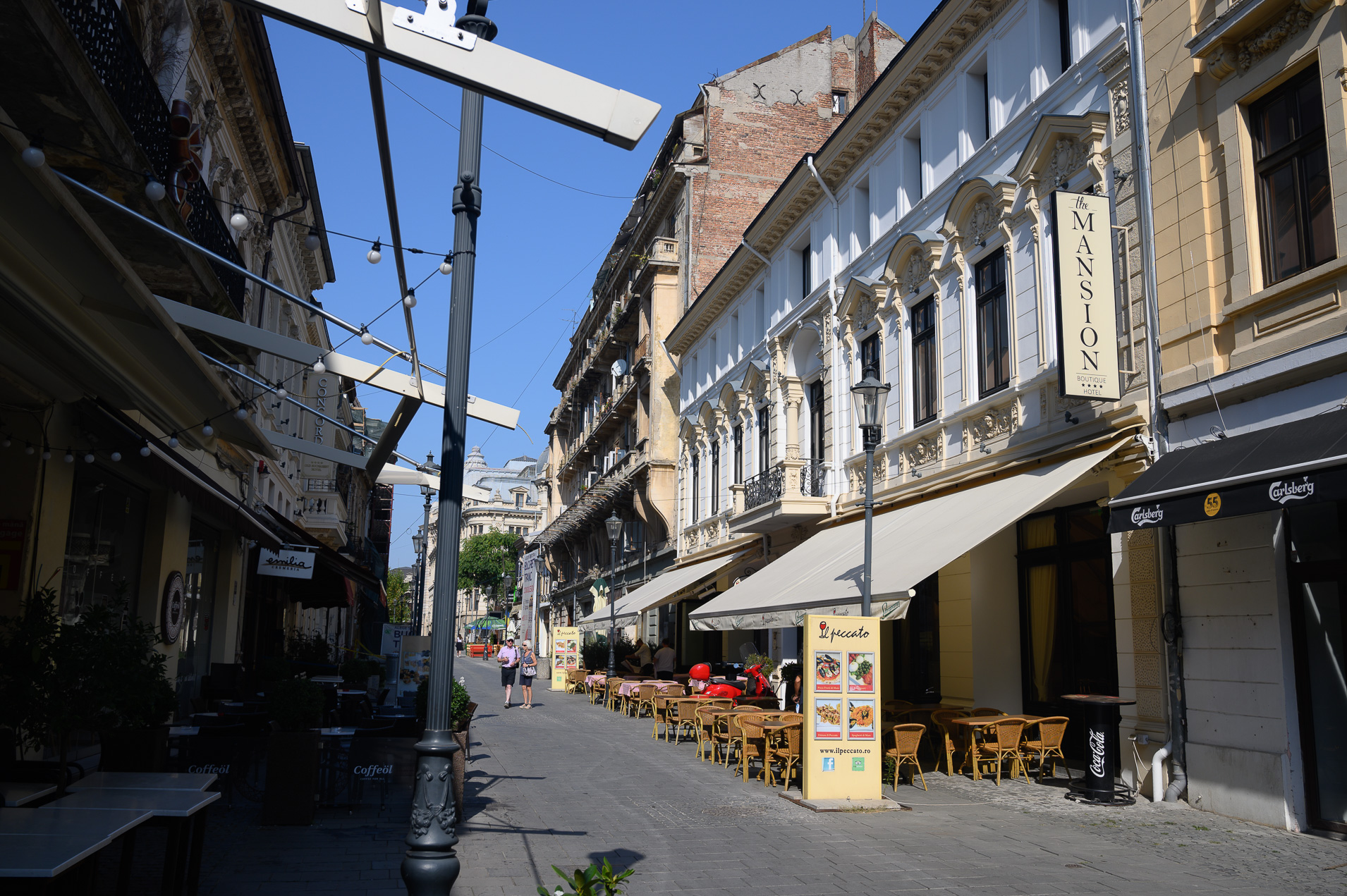 ... Right next door are renovated buildings and hip amenities for tourists and the city's emerging middle class.