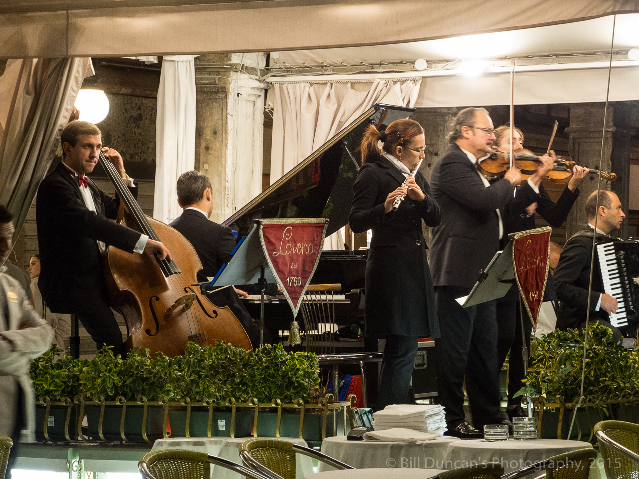 Bands on three sides of piazza take turns filling the night with song.